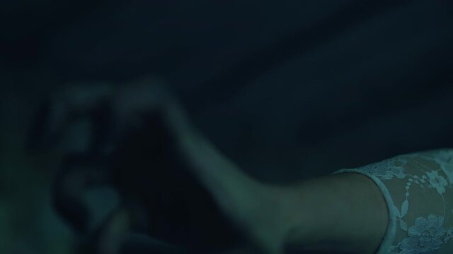 Terrifying faceless zombie woman making scary hand moves, creepy face close-up