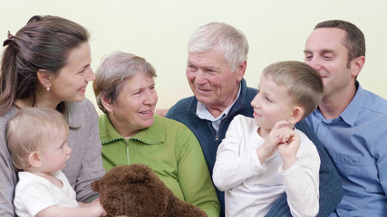Complete family portrait, children, parent and grandparents spend time together