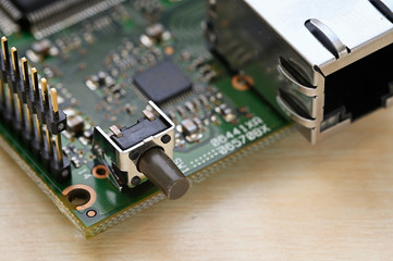 Push button switch on PCB.