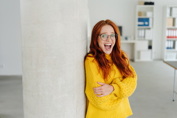 Young woman laughing at the camera