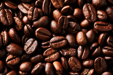 Roasted coffee beans background. For design and texture Close up.