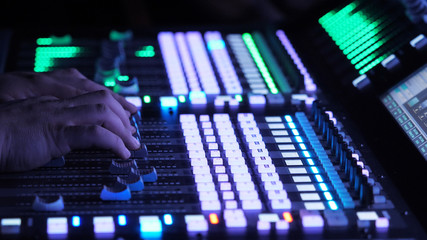 Sound engineer mixing music in studio