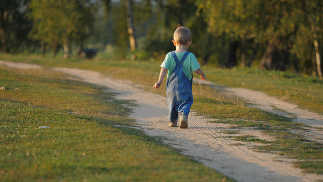 child walking away drawing