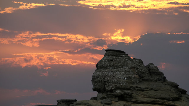 The Sphinx Rock (Sfinxul) in Bucegi Mountains Romania at sunset