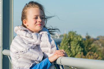 Little girl posing on the bridge
