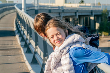 Little girl posing on the bridge