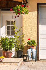 The original decoration of the facade of the house, flowers in pots
