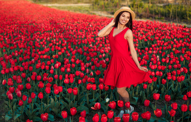 Optimistic lady walking amidst flowers