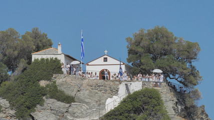 Tourists and wedding participants on the terrace of Agios Ioannis church