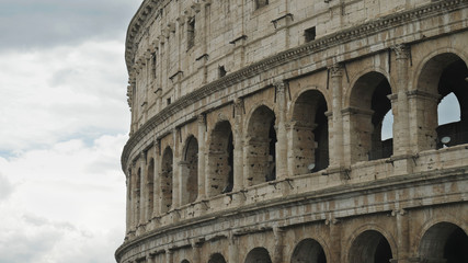 Detail of colosseum ancient building, rome landmark and a piece of open sky