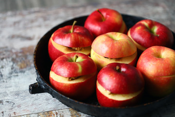 Apples before baking. Baked apples with cinnamon and honey. Selective focus. Macro.