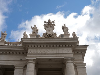 Fototapeta na wymiar Statuary on San Pietro Papal Basilica in Vatican