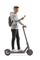 Male student with a backpack on an electric scooter using a mobile phone © Ljupco Smokovski