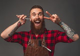 Excited barber gesturing V sign