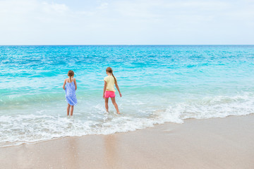 Kids have a lot of fun at tropical beach playing together