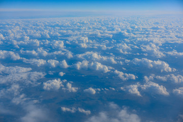 Fototapeta na wymiar Sky and clouds from above the ground viewed from an airplane