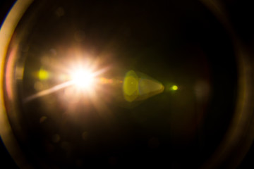 Abstract Natural Sun flare on the black background.