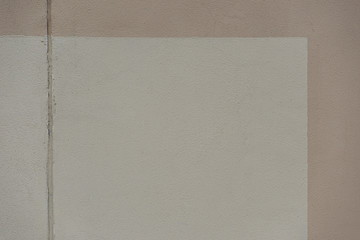 Smooth white and beige concrete wall texture with horizontal strip