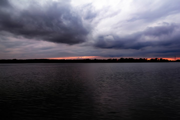 Pending storm clouds over the river