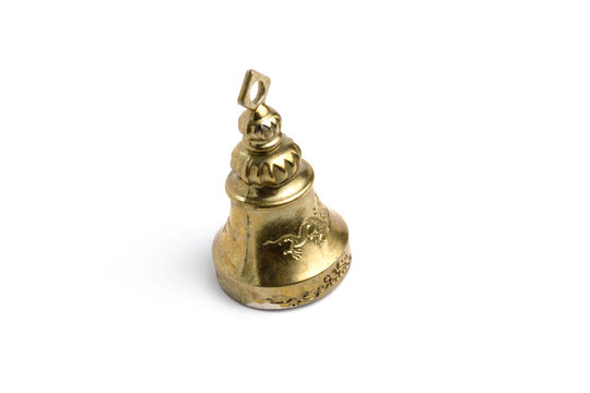 Golden bell with a dragon on a white background isolate