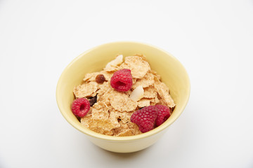 Dry cereal breakfast cereal with berries and nuts in a bowl