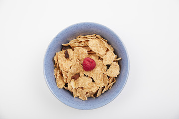 Dry cereal breakfast cereal with berries and nuts in a bowl