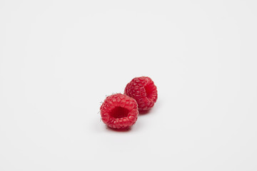 Raspberry red fresh berry on a white background