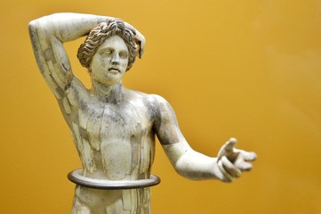 statue of an angel on yellow background