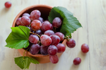 Beautiful red grapes are in the bowl.