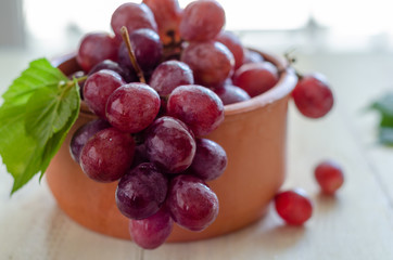 Beautiful red grapes are in the bowl.