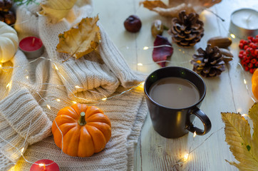 Autumn still life with pumpkins,coffee,leaves and pinecone