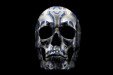Human skull with pattern on black background. Fragment of wall, with traditional Portuguese, glazed ceramic tiles.