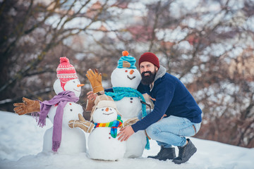 Happy hipster winter portrait. Handsome bearded man, father in winter clothes. Winter emotion....