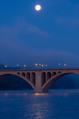 Naklejka na ściany i meble Waning Full Moon Over Key Bridge and the Potomac River As Dawn Approaches