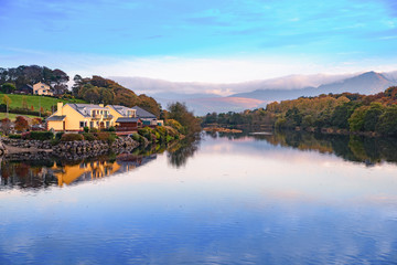 Obraz premium Spectacular view landscape mountain hill foggy day sunrise Killorglin Kerry Ireland red green forest