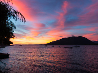 Amazing sunset on the banks of Lake Ranco, in the village of Llifen. Los Rios Region, in Araucania or Patagonia zone, Chilean Andes. South of Chile.