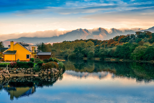 Spectacular view landscape mountain hill foggy day sunrise Killorglin Kerry Ireland red green forest