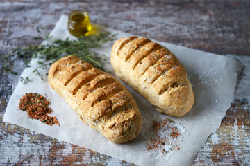 Delicious fresh homemade bread. Italian bread with herbs. Selective focus. Macro.