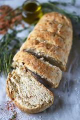 Delicious fresh homemade bread. Italian bread with herbs. Selective focus. Macro.