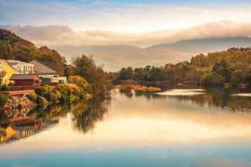 Fototapeta premium Spectacular view landscape mountain hill foggy day sunrise Killorglin Kerry Ireland red green forest