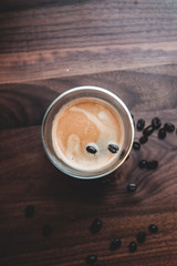 Cup of coffee with coffee beans