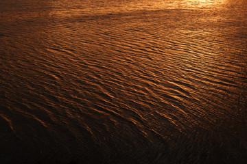 Beautiful water at a Fiery orange sunset.