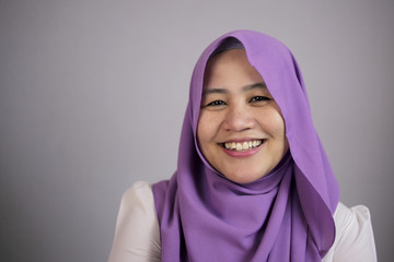 Smiling Muslim Woman With Freckles