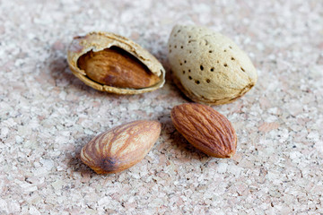Almond kernels on a cork background. Selective focus.