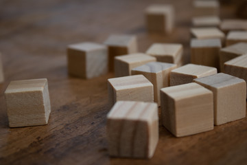 Wooden small blocks on the background. Background for desktop. Office style.Agile and scrum. Team players.Social life.In the office.Equality and diversity