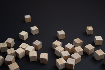 Obraz premium Wooden small blocks on the background. Background for desktop. Office style.Agile and scrum. Team players.Social life.In the office.Equality and diversity