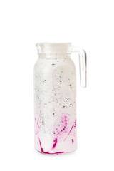 Closeup jug of sweet blended smoothie with coconut milk, berries and dragon fruit isolated at white background. Homemade yogurt as healthy lifestyle vegan super food for detox.
