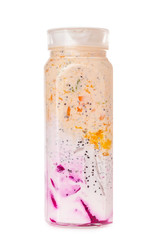 Jug of fresh healthy layered yougurt with fruits and berries isolated at white background. Concept of detox and vegan healthy lifestyle.