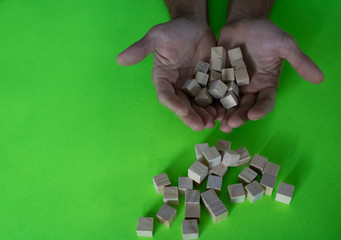 Wooden small blocks on the background. Background for desktop. Office style.Agile and scrum. Team players.Social life.In the office.Equality and diversity