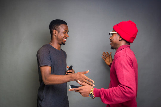 two young men feeling excited and about to give a hand shake - Powered by Adobe